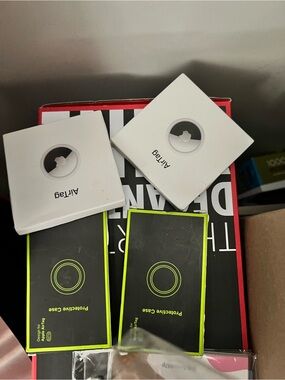 Spigen Protective AirTag Cases with Neon Green Accents